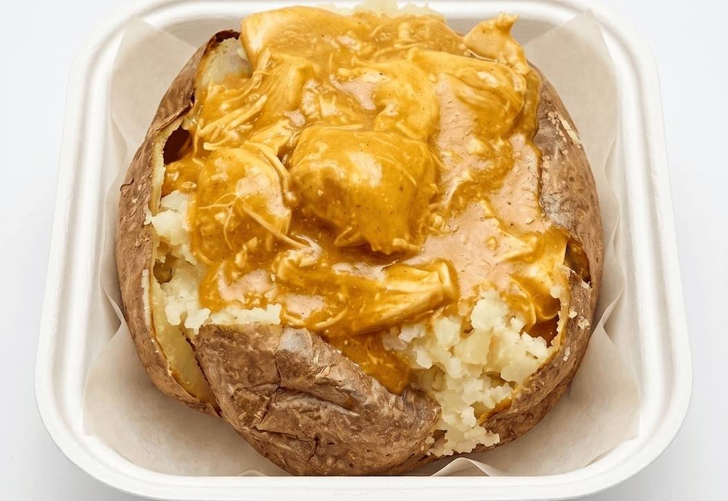 Jacket potato topped with homemade chicken curry