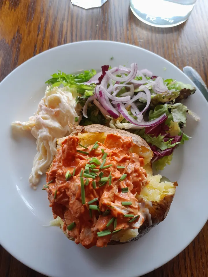 Jacket potato topped with homemade chicken curry